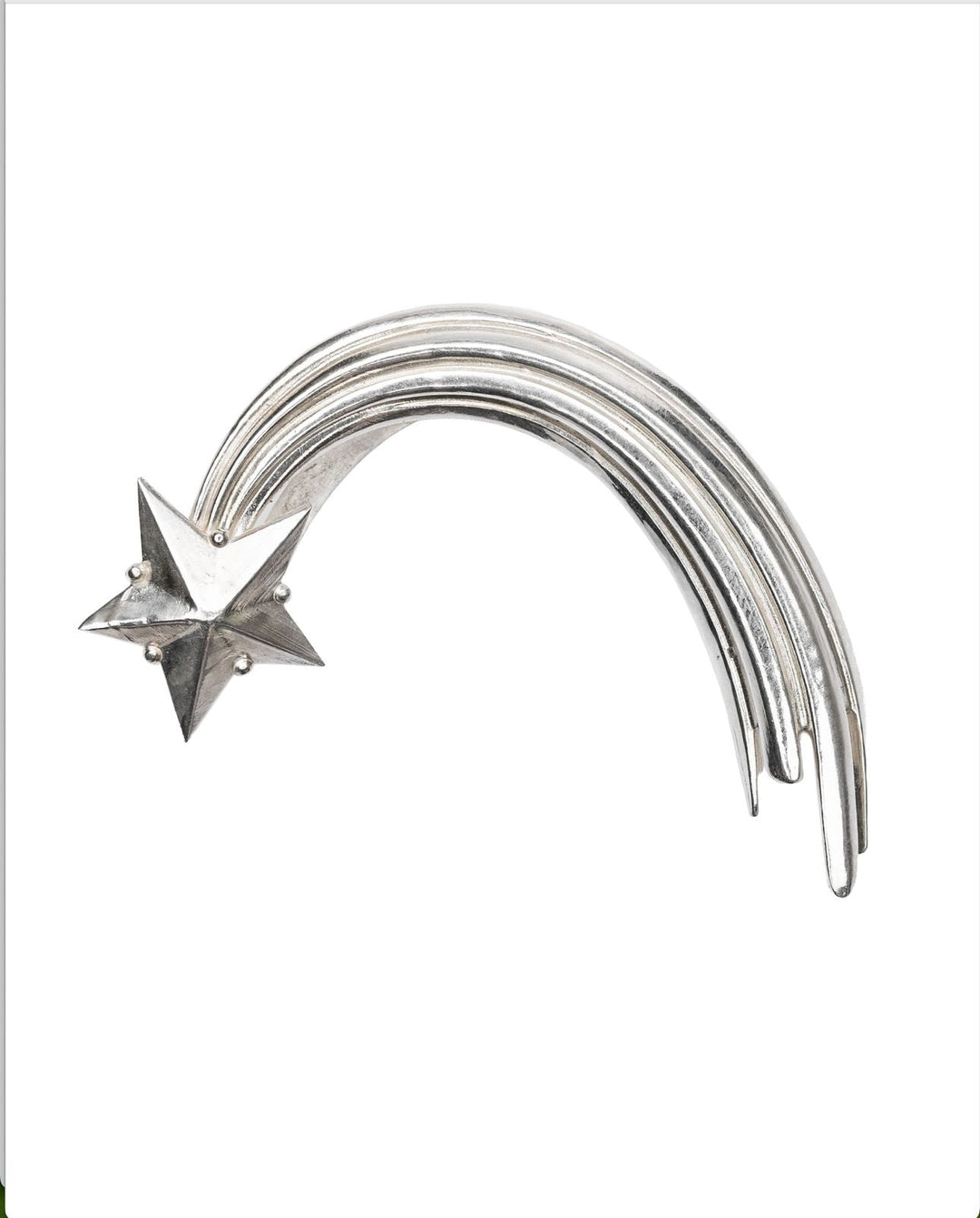 Silver Comet ear cuff on a white background